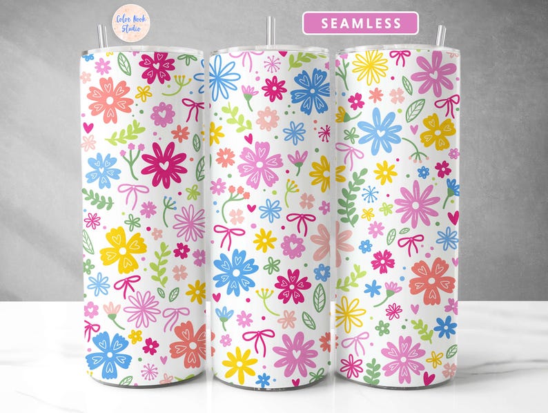 May include: A seamless pattern with colorful flowers and hearts on a white background. The pattern is repeated on three different tumblers.
