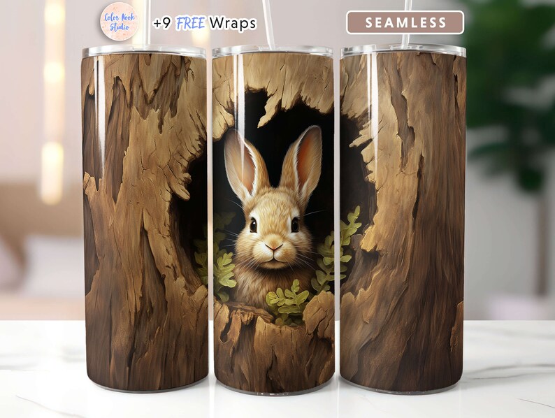 May include: A brown and tan tumbler with a seamless design of a rabbit peeking out of a tree trunk. The tumbler has a white lid and straw. The text "+9 FREE Wraps" is visible on the image.