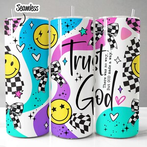 May include: Three colorful stainless steel tumblers with a white background. The tumblers feature a checkered pattern, smiley faces, bows, stars, and the text "Trust God. There was no way, But God made a way."