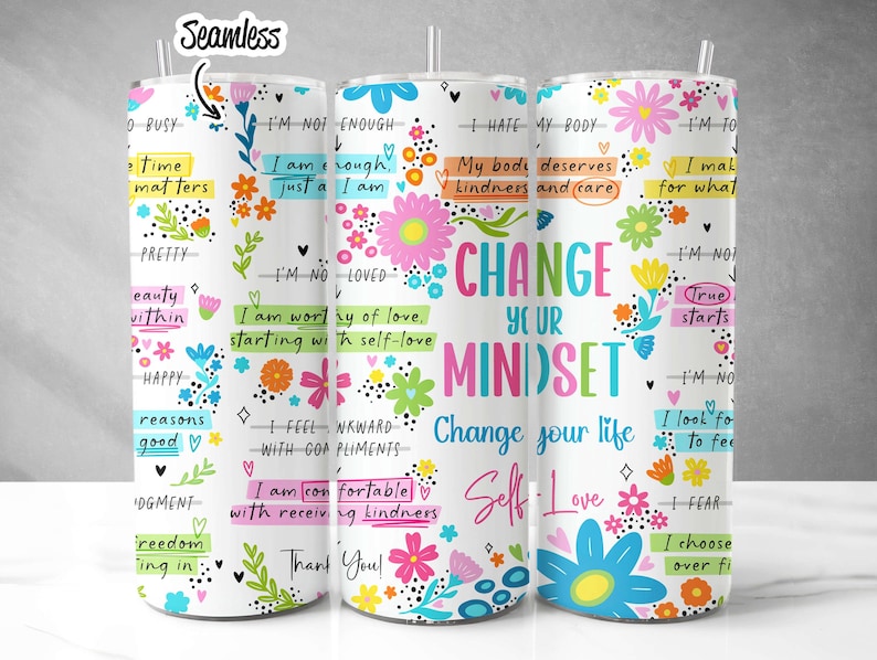 May include: Three white tumblers with colorful floral designs and inspirational quotes. The tumblers feature phrases like "Change Your Mindset", "I'm Worthy of Love", and "True Starts".