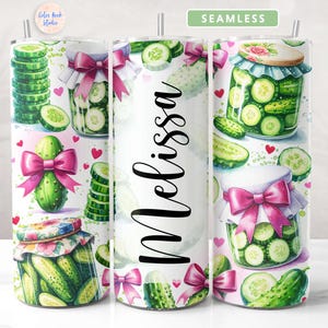 May include: A white tumbler with a seamless pattern of pink bows, green pickles, and jars of pickles. The tumbler has the name "Melissa" written on it.