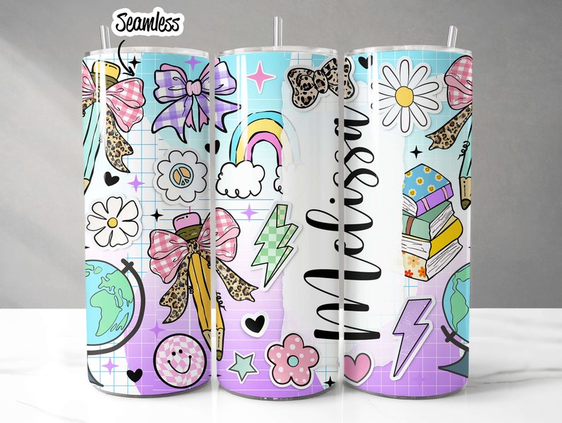 May include: Three stainless steel tumblers with colorful, whimsical designs. The designs include a rainbow, a globe, a bow, a pencil, a stack of books, a daisy, and the word "miss" in a script font. The tumblers are perfect for school, work, or everyday use.