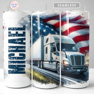 May include: A white tumbler with a blue and white design featuring the name "MICHAEL" and a semi-truck driving on a road with an American flag in the background.