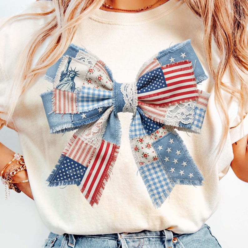May include: A patriotic bow with a patchwork design incorporating the American flag, Statue of Liberty, and floral patterns. The bow uses red, white, and blue fabrics, including denim, gingham, and lace, for a rustic, handcrafted look. Ideal for Independence Day.