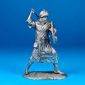 Tin miniature, figurine of Berber Warrior, 12th century. Metal Figure a Berber Warrior, 12th century. Scale 1:32, tin 54mm.