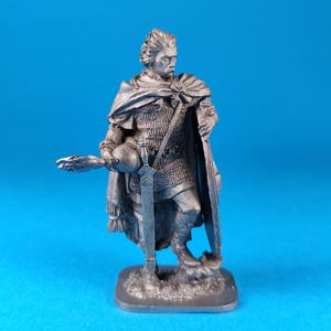 White metal miniature figurine of а Noble Gallic warrior, 1st century BC. Metal Figure of а Noble Gallic warrior, 1st century BC.