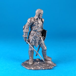 White metal miniature figurine of а German knight, XIV century. Metal Figure of а German knight, XIV century