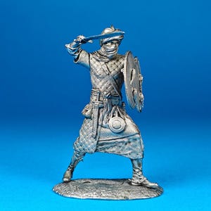 Tin miniature, figurine of Elite Warrior Bodyguard Berber, 12th Century. Metal Figure a Berber. Scale 1:32, tin 54mm.