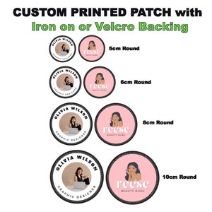 May include: Four round iron-on or velcro backed patches in different sizes: 5cm, 6cm, 8cm, and 10cm. Each patch features a pink circle with a woman's face and the text "reese beauty guru". The outer circle of each patch is black with white text that says "Olivia Wilson Graphic Designer".