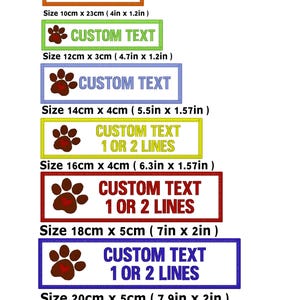 May include: A set of seven rectangular custom dog paw embroidery patches in various colours including orange, green, blue, yellow, red, purple, and black. Each patch features a brown paw print with a red heart and text reading CUSTOM TEXT.