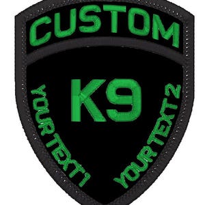 May include: Black and green embroidered patch with the text "CUSTOM" at the top, "K9" in the centre, and "YOUR TEXT" on the left and right sides of the patch.