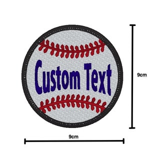 May include: A white baseball with red stitching and a blue "Custom Text" inscription. The baseball is 9 inches in diameter.