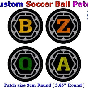 May include: Custom soccer ball patches featuring the letters B, Z, Q, and A in yellow, orange, and green. Each round, black patch is 9cm in diameter. The text "Custom Soccer Ball Patch" is at the top.