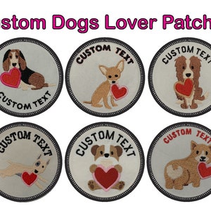 May include: Six embroidered iron-on patches featuring different dog breeds holding hearts. Each patch has a white background with black text that says "CUSTOM TEXT".