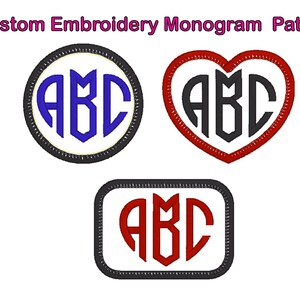 May include: Three embroidered monogram patches featuring the letters "ABC" in different styles. The first patch is a circle with a black outline and a white background. The letters are blue. The second patch is a heart shape with a red outline and a white background. The letters are black. The third patch is a square with a black outline and a white background. The letters are red.