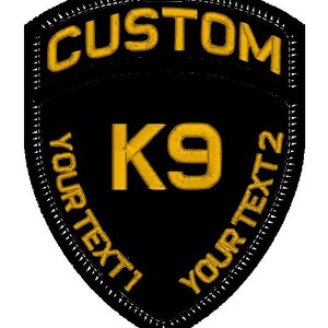 May include: Black and gold embroidered patch with the text "CUSTOM" at the top, "K9" in the centre, and "YOUR TEXT 1" and "YOUR TEXT 2" on the sides.