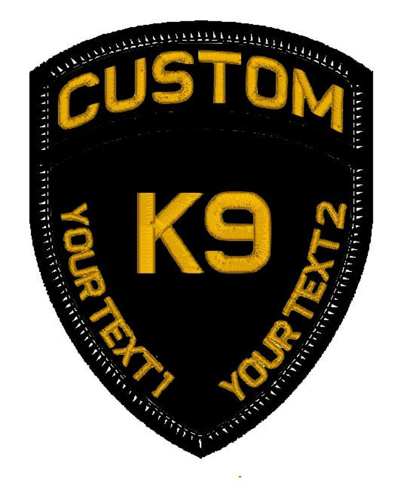 May include: Black and gold embroidered patch with the text "CUSTOM" at the top, "K9" in the centre, and "YOUR TEXT 1" and "YOUR TEXT 2" on the sides.