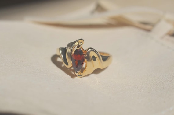 Garnet Ring Swirling Gold Modern Artistic Design