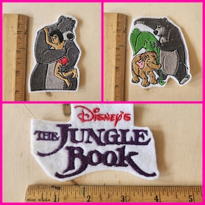 May include: Three embroidered patches featuring characters from Disney's The Jungle Book. One patch shows Baloo hugging Mowgli, another shows Baloo with an elephant, and the third patch has the movie title.
