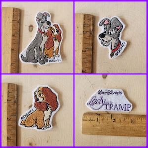 May include: Four embroidered patches featuring Lady and the Tramp. The first patch shows Lady and Tramp together, the second patch shows Tramp, the third patch shows Lady, and the fourth patch shows the text "Walt Disney's Lady and the Tramp".