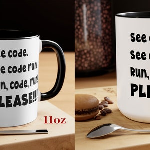 May include: Two white ceramic mugs with black rims and handles are displayed. The mugs have the text "See code. See code run. Run, code, run! PLEASE!!!" in black. One mug is labeled 11oz, the other 15oz. A spoon and a macaron are in the foreground.