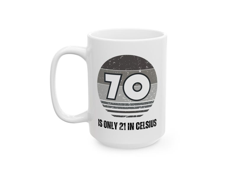 White ceramic mug featuring a vintage-style circular graphic with the number “70” and the text “Is only 21 in Celsius” in black lettering.