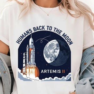 Camiseta "Los humanos regresan a la Luna Artemis II", camiseta inspirada en la misión espacial de la NASA, camiseta gráfica del lanzamiento de Artemis 2, regalo para amantes del espacio.