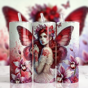 May include: A stainless steel tumbler with a colorful design featuring a fairy with red wings, red hair, and a floral crown. The design also includes pink orchids and a watercolor background.