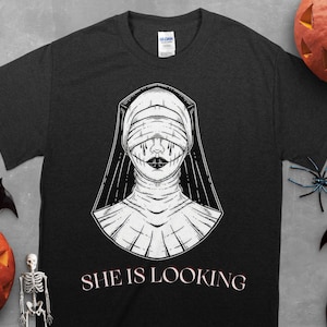 Scary nun She Is Looking blind nun Unisex T-Shirt. Punk Shirt, Funny Shirt, Goth Shirt, Spooky Shirt, Nun Shirt, Tattoo Shirt