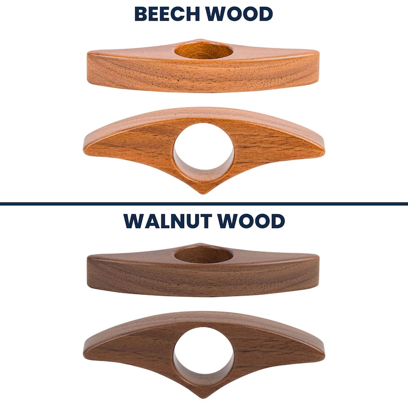 May include: Two wooden thumb page holders, one in beech wood and one in walnut wood. The beech wood holders are light brown, and the walnut wood holders are dark brown. Each has a finger hole and a triangular top.