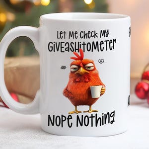 May include: White ceramic coffee mug with a red rooster illustration and the text "Let me check my Giveashitometer Nope Nothing".