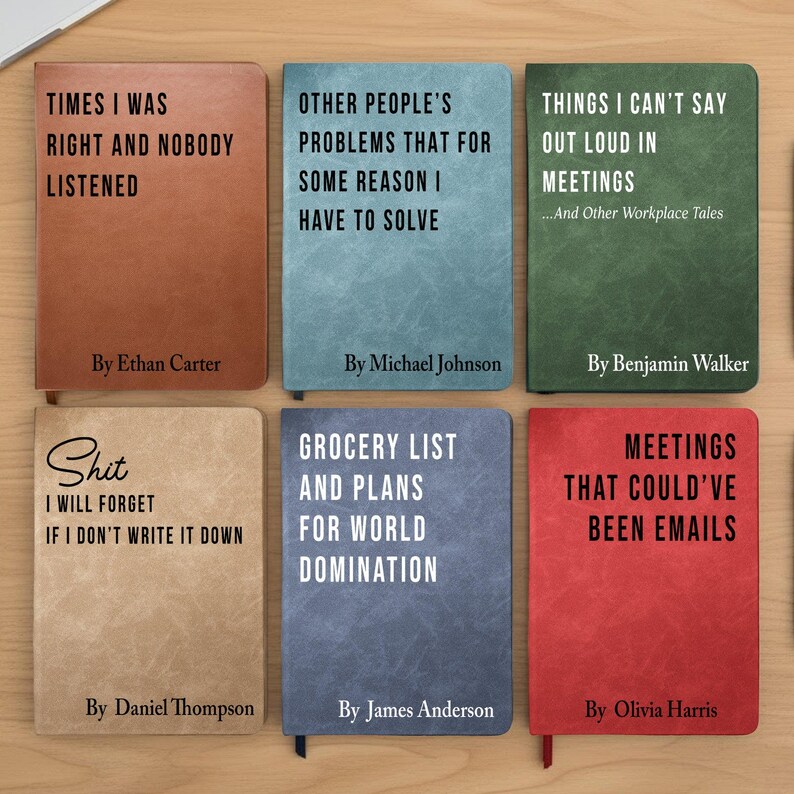 May include: A collection of six hardcover notebooks with humorous titles and author names. The notebooks are in various colors, including brown, blue, green, tan, and red. The titles include phrases like "Times I Was Right and Nobody Listened" and "Meetings That Could've Been Emails."