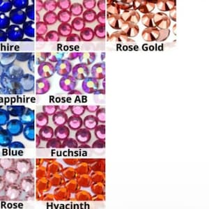 May include: A chart showing different colors of rhinestones. The colors are: Sapphire, Rose, Rose Gold, Light Sapphire, Rose AB, Capri Blue, Fuchsia, Light Rose, and Hyacinth.