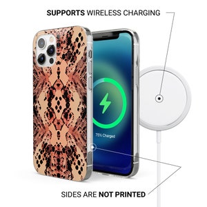 May include: A clear phone case with a pink and black snake skin pattern. The case is compatible with wireless charging. The text "SUPPORTS WIRELESS CHARGING" and "SIDES ARE NOT PRINTED" is visible in the image.