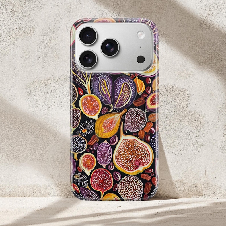 Slim Aboriginal dot art phone case with purple and gold circular motifs, colorful art phone case on neutral textured surface
