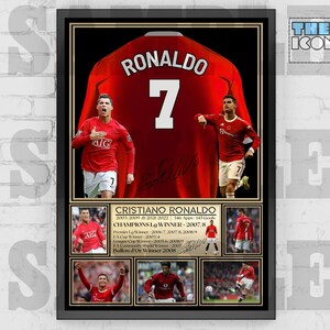 May include: A framed poster featuring a red soccer jersey with the name "RONALDO" and the number "7" on the back. The poster also includes photos of Cristiano Ronaldo in action, along with his career statistics and achievements, including "Champions Lg Winner - 2007/8" and "Ballon d'Or Winner 2008".