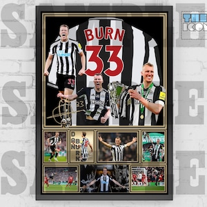 May include: A framed photo collage of a soccer player wearing a black and white jersey with the name "BURN" and number "33" on the back. The collage includes photos of the player celebrating with a trophy and other players in action.