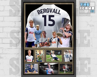 May include: Framed print featuring a soccer jersey with the name "Bergvall" and the number "15". The print includes multiple images of a soccer player, a signature, and a trophy. The background is black.