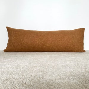 oversized long lumbar pillow. teddy boucle textured. camel color.