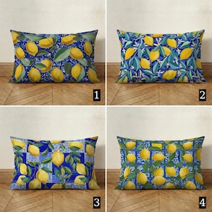 May include: Four rectangular throw pillows with lemon designs. Each pillow features a different pattern of yellow lemons and green leaves on a blue background. The designs include tile and floral patterns.