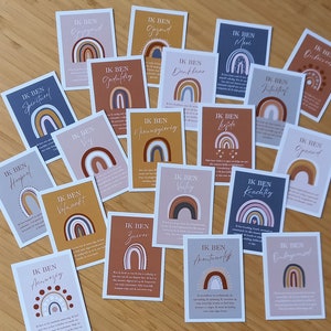 May include: A collection of 18 cards with rainbow designs and Dutch text. Each card features a different affirmation, such as "Ik ben spiritueel" (I am spiritual) and "Ik ben volmaakt" (I am perfect).