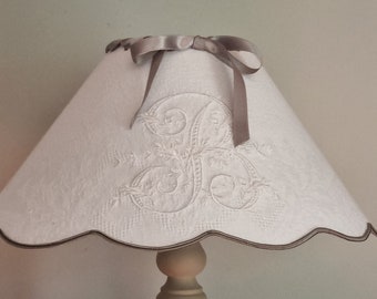 Monogram embroidered lampshade in old napkin and ribbon