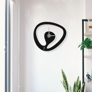 Modern Black Metal Wall Clock: Unique Vertical Design