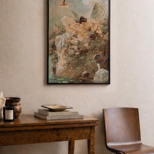 May include: A framed wall art print featuring a painting of two winged figures resting amidst lush flowers and greenery near a body of water with a white swan. The artwork displays soft pastel tones, intricate details of foliage, and a bird in flight.