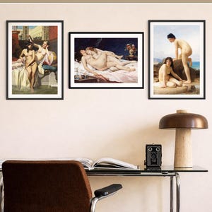 May include: Three framed art prints displayed on a wall above a desk. The prints feature classical paintings of figures in various settings. The text at the top reads: YOU CAN FIND MORE MATCHING PRINTS ON MY ETSY SHOP. The frames are black.