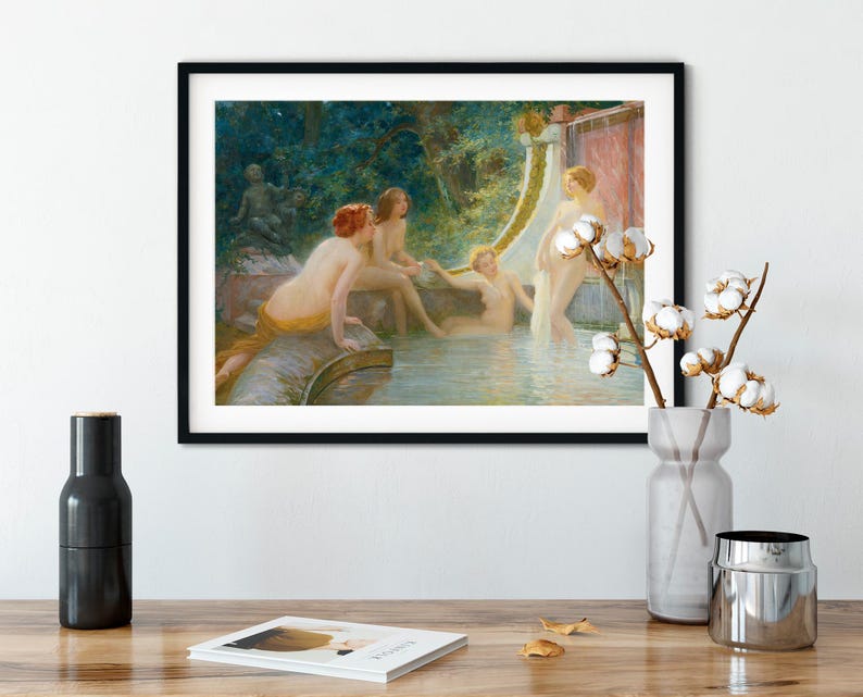 May include: Framed art print of a classical painting depicting nude figures in a serene, outdoor setting. The artwork features a water feature, lush greenery, and figures with red hair. The painting is displayed in a black frame.