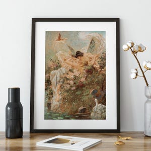 May include: A framed art print featuring a classical painting of two winged figures resting amidst lush greenery and flowers near a pond with a white swan. The scene includes soft pastel tones, flowing drapery, and a small bird flying in the sky.