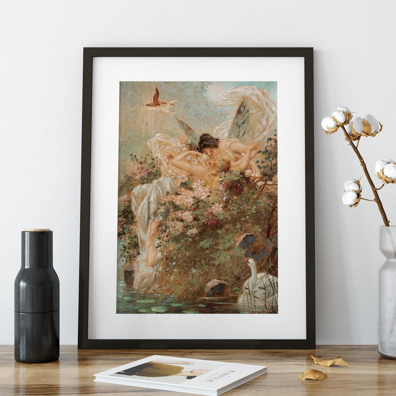 May include: A framed art print featuring a classical painting of two winged figures resting amidst lush greenery and flowers near a pond with a white swan. The scene includes soft pastel tones, flowing drapery, and a small bird flying in the sky.