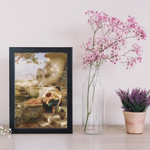 May include: A framed art print with a black frame depicts a classical scene with two figures near a fountain. A clear glass vase holds pink flowers, and a small potted lavender plant sits nearby. The scene is set on a light-colored wooden surface.