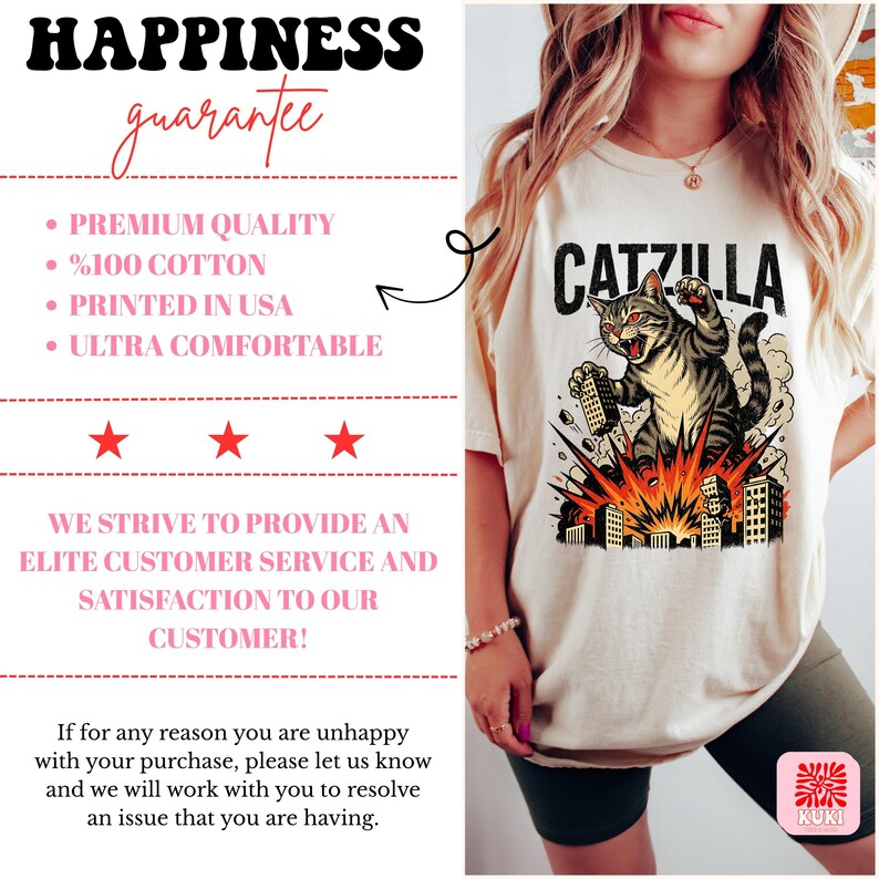 May include: Cream-colored t-shirt featuring a graphic of a cat labeled "Catzilla" destroying buildings. The cat is gray and brown with red eyes. The shirt also has text that says "Happiness Guarantee", "Premium Quality", "%100 Cotton", "Printed in USA", and "Ultra Comfortable".